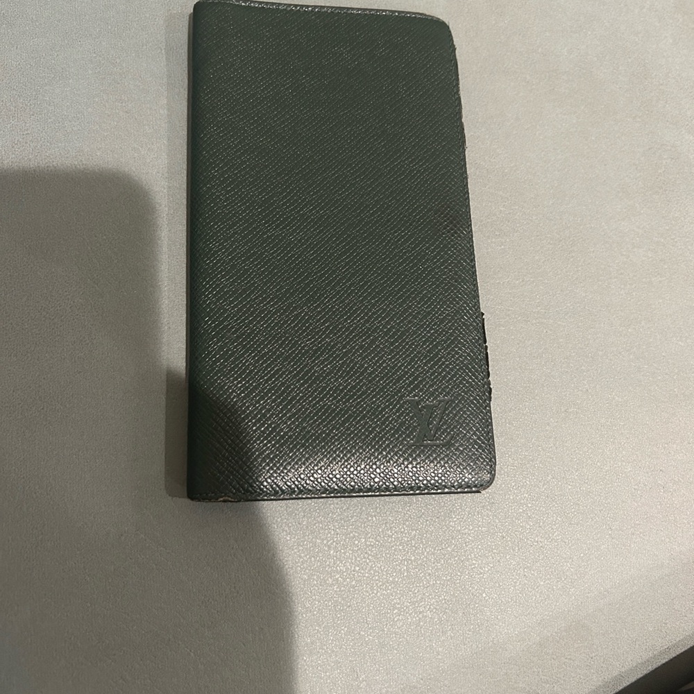 Louis Vuitton Long Wallet in green Taiga leather.